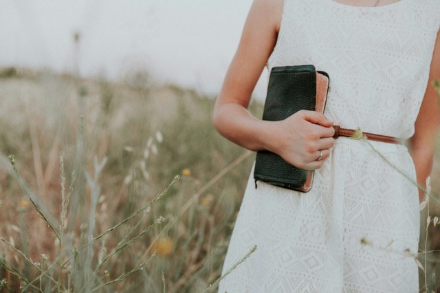 Woman outdoors with Bible