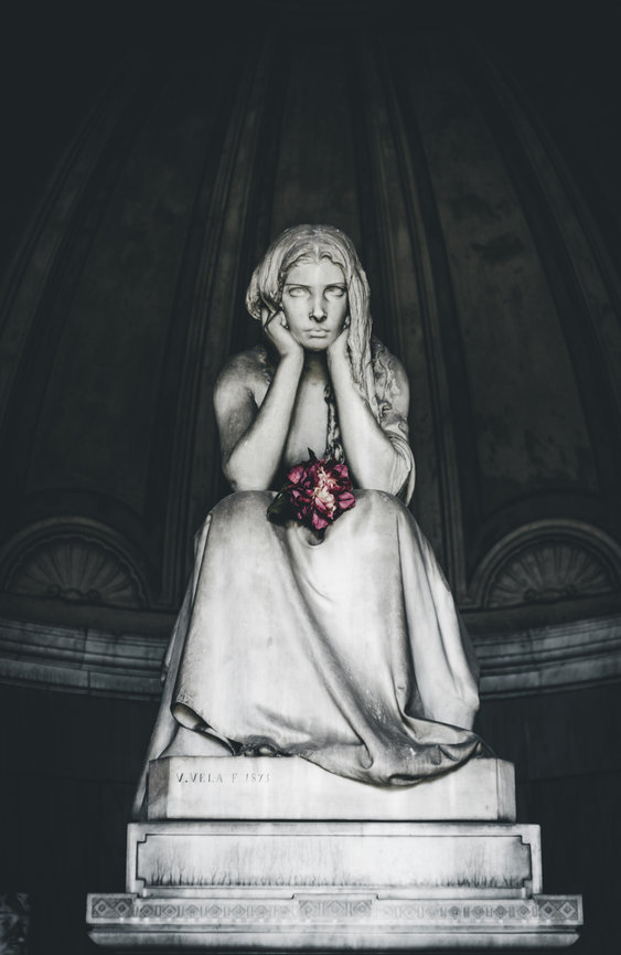 Female statue on pedestal