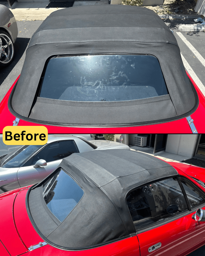 Close-up of damaged black cloth top and separating rear window on red Mazda Miata at Anaheim auto upholstery shop